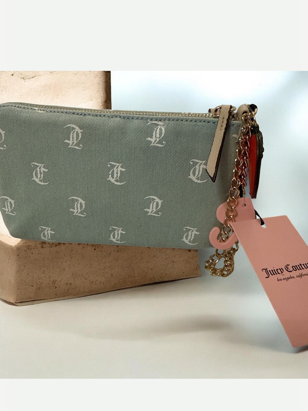 Juicy Couture light denim Monogram Canvas Wristlet with strawberry charm